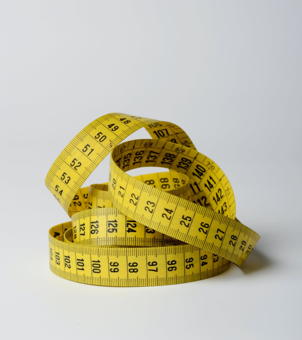 close up photo of yellow tape measure